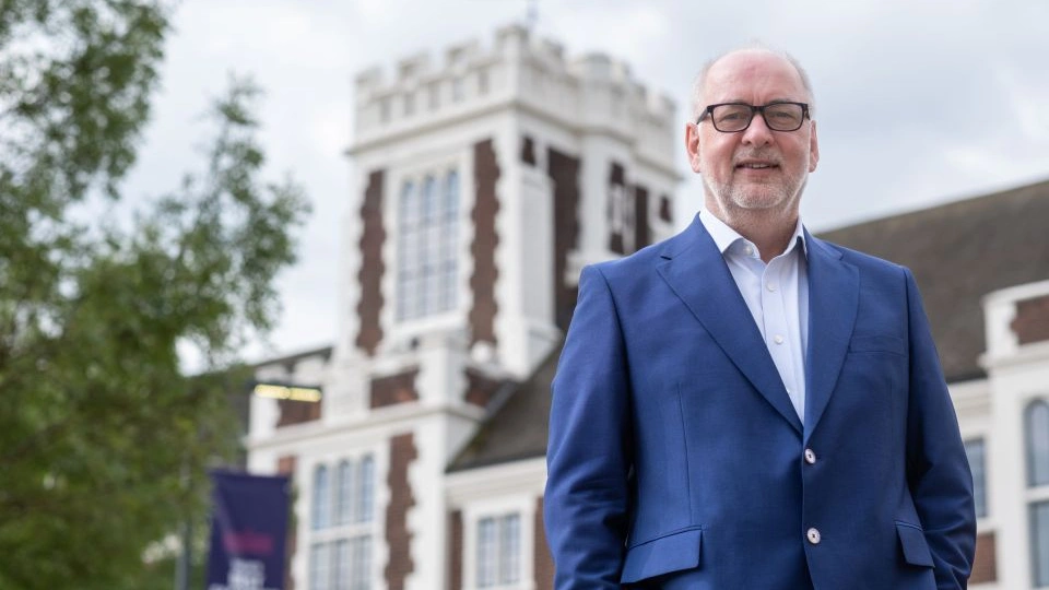 Vice-Chancellor Professor Nick Jennings stood in front of the University's Hazlerigg Building