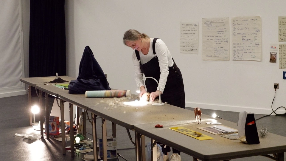 Artist working on art pieces
