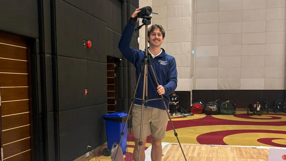A photo of Owen Tolfrey setting up the cameras to collect data at the wheelchair rugby championships