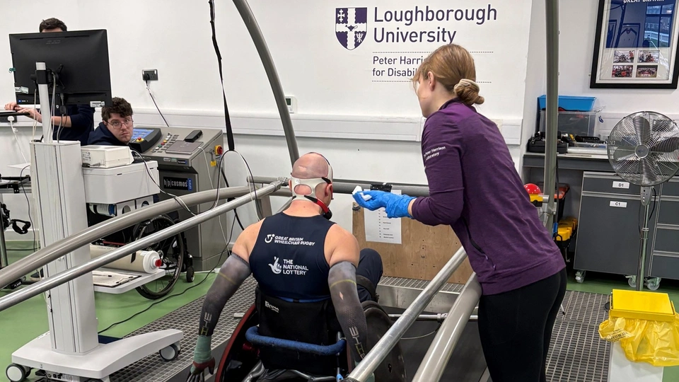 Doctoral researcher Sarah Schonenberg testing a wheelchair rugby athlete on the treadmill