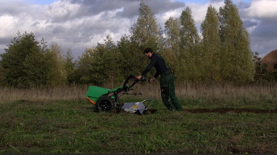 Man pushing aftrak tractor