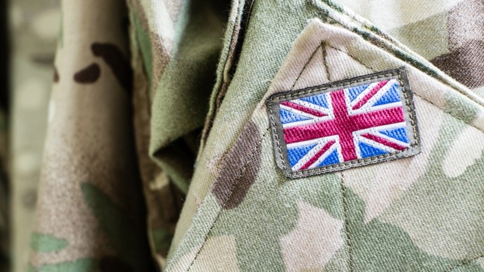 An army uniform with a Union Jack on the sleeve