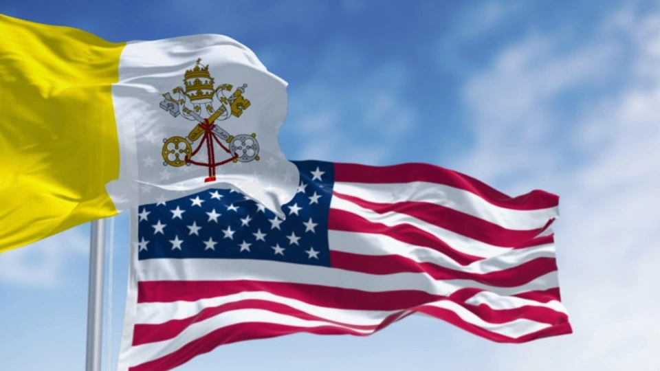 The Vatican flag and the Star and Stripes flying together