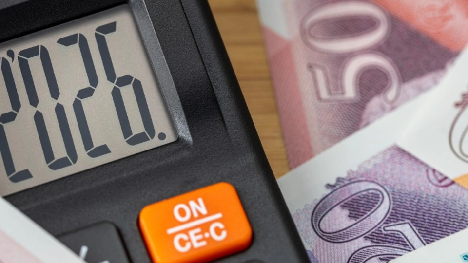 A calculator and british pound notes