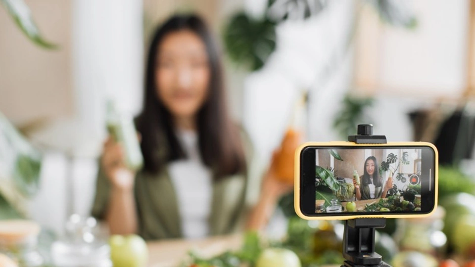 a girl is filming content for her social media channel